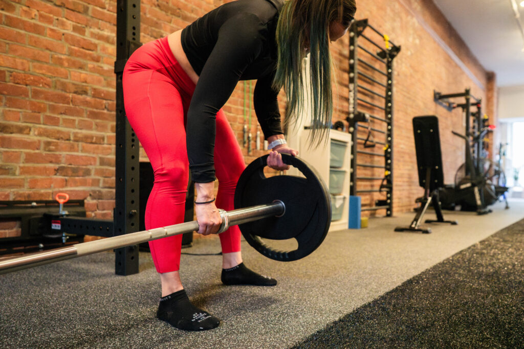 A Trainer prepares for strength training.